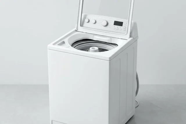 White top-load fully automatic washing machine with the lid open in a home utility area.