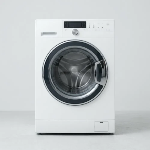 White front-load washer dryer combination machine built into a laundry nook.